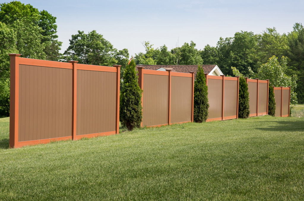 Illusions V300-6 Tongue and Groove vinyl privacy fence panels shown in Brick Red (E108) and Brown (L106). If you're looking for the great backyard idea of a PVC vinyl brown or brick red fence, Grand Illusions Color Spectrum is your match. #fenceideas #homeideas #yardideas