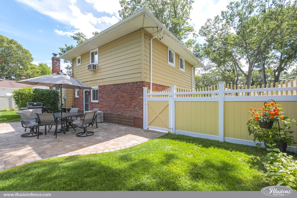 Yellow and white pvc vinyl fence to match home